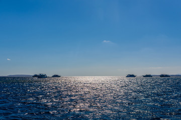 White yachts in Red sea not far from the Hurghada city, Egypt