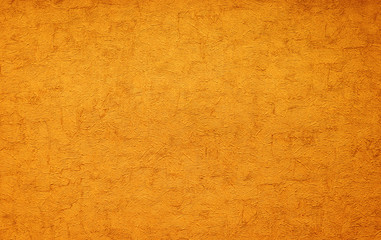 gold texture of rough putty on the wall.