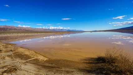 Dry lake beds in Death Valley come to life with water and flood in the winter of 2018 