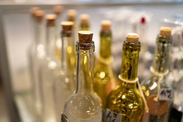 Yellow and white glass bottles in a shop