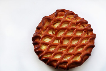 Pie on a white background, a great start to the working day, delicious dessert for a good mood.