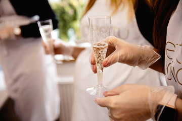 Three friends toasting with champagne glasses. Young happy women cheering with sparkling wine, chatting and celebrating, slumber party, copy space