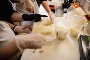 Mousse yogurt cake. Girls in a cooking process. Culinary masterpieces