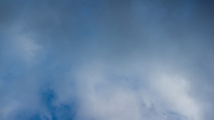 dark blue sky with white clouds