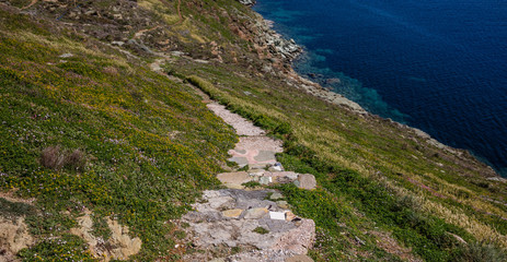 Greece. Kea island. Pathway, landscape in springtime and blue sea water
