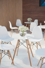 White chair and white flowers