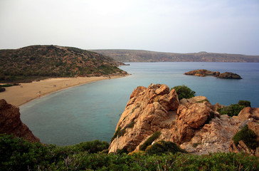 Cliff overlooking an isle with some trees, Vai beach of Crete Island