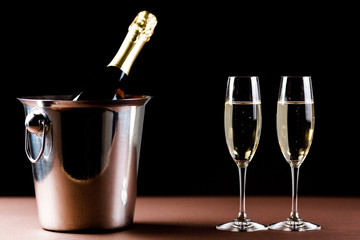 Champagne glasses on black background. Holiday celebration concept.