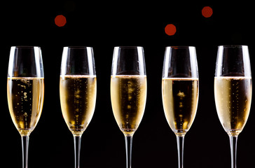 Champagne glasses on black background. Holiday celebration concept.