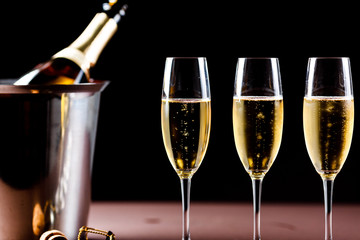 Champagne glasses on black background. Holiday celebration concept.