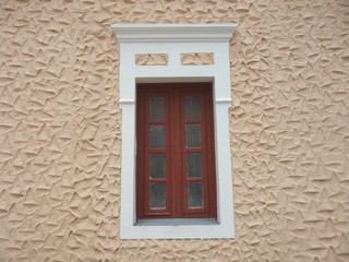 Classic red window on beige wall
