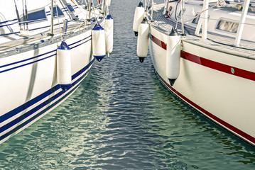 Blue and red motorboats in the marina