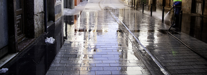 Sweeper cleaning street