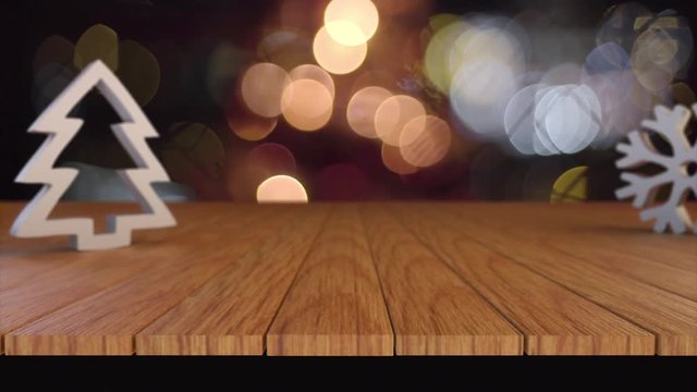 Wood table with Christmas blurry bokeh light background.