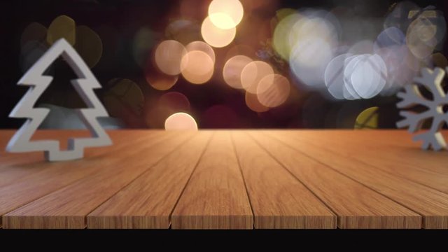 Wood table with Christmas blurry bokeh light background.
