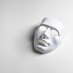 White mask on white background