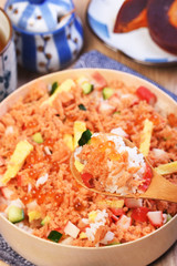 Chirashi sushi bowl with salmon, cucumber, salmon roe and sweet omelette, Japanese Food.