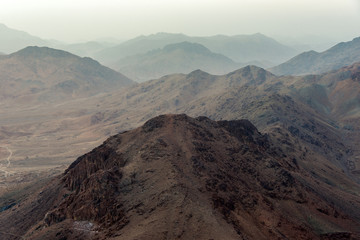 Middle East or Africa, picturesque bare mountain range and a large sandy valley desert landscapes landscape photography