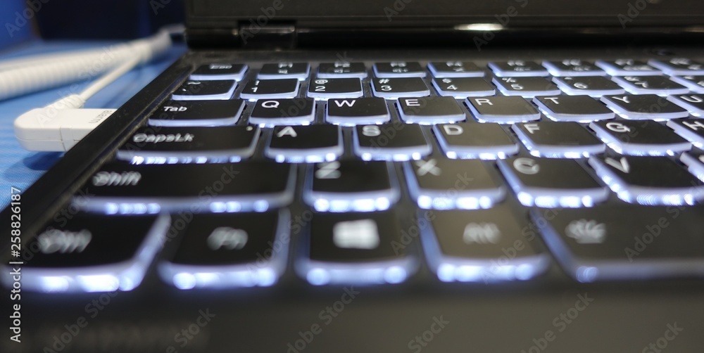 Poster computer keyboard with alarm socket plugged in usb port