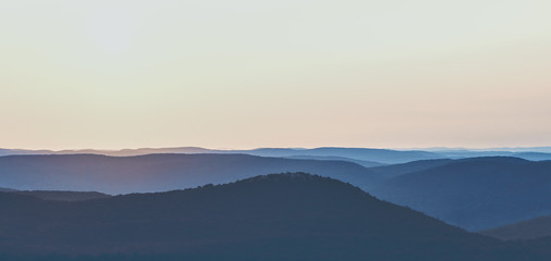 Sunrise Over a Mountain Range - obrazy, fototapety, plakaty