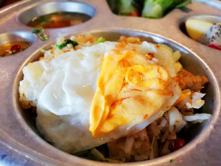 fried eggs topping on fried rice for Thai local food