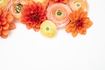 Orange and Blush Ranunculus and Dahlia Floral background with copy space