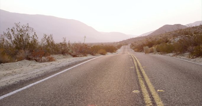 Desert highway at sunrise - wide shot