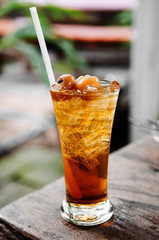 Herbal tea - Longan iced tea beverage in tall glass.