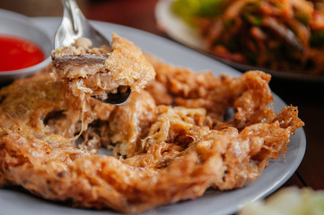 Thai crispy fried egg omelet with meckerel