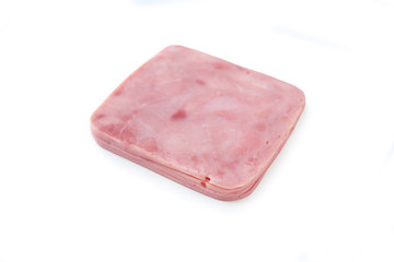Piece of sliced pork ham isolated over white background.