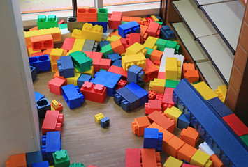 Pile of colorful big blocks building toys foam. Education preschool indoor playground.