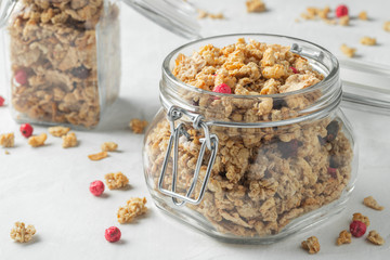 Homemade granola with berries in a mason jar.