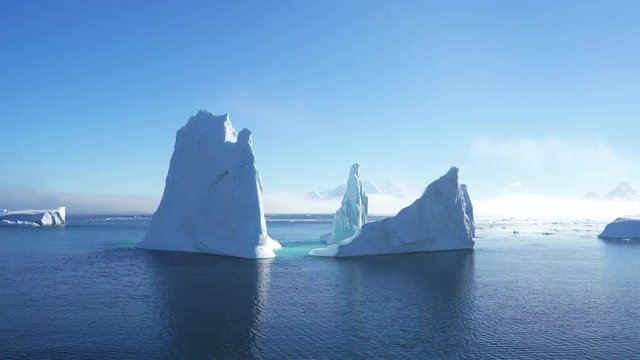 Antarctica Huge Icebergs and Foggy Mountains