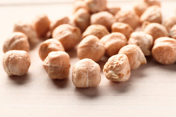 Chickpeas closeup on white wooden background
