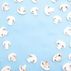 Sliced mushrooms on blue background