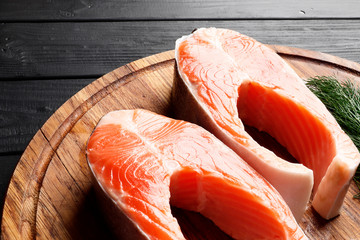 Cut fresh salmon on a wooden table