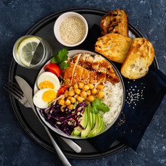 Buddha bowl Rice chickpeas chicken breast eggs vegetables top view