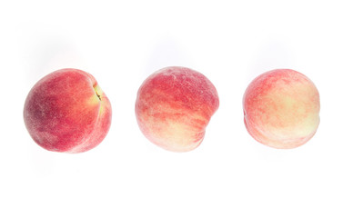 Overhead view of peaches isolated on white background