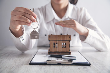 Business girl protect house. House insurance concept