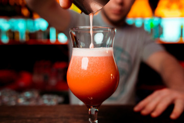 orange cocktail at the bar