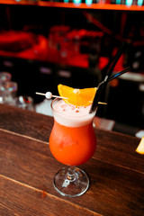 orange cocktail at the bar