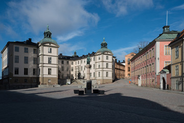 Fototapeta na wymiar An sunny spring day at the Riddarholmen island in Stockholm with old courthouses and medieval church