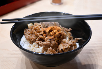 Simmer slice beef with rice in Japanese style.