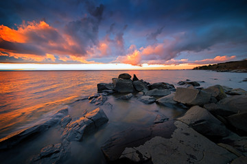 Fantastic Sunset Clouds over Ocean with Reflections