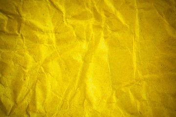 Texture crumpled yellow paper background.