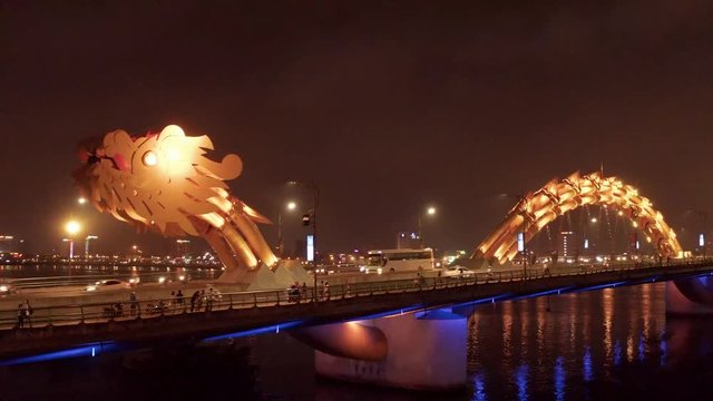 Aerial view of Dragon bridge at night.