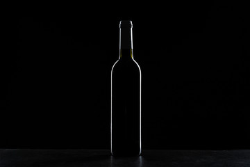 Fototapeta na wymiar wine bottle in a black background