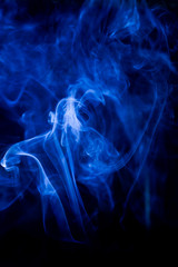 Obraz premium Blue toxic fumes movement on a black background.