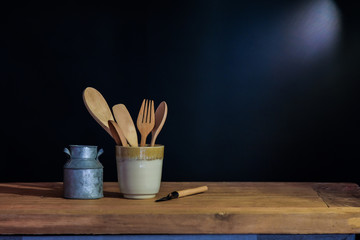 wood spoon and fork in cup , still life concept.