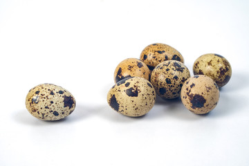 Fresh Quail eggs on background.Food and health concept.